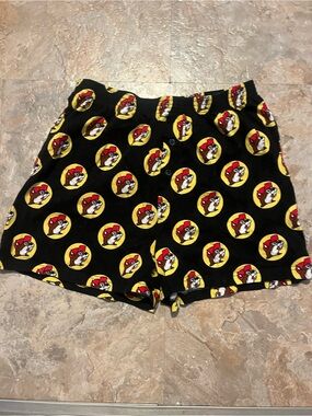 Buc-ee’s Black Athletic Shorts with Yellow & Red Character Dot Print